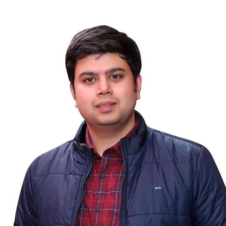 Man in jacket and plaid shirt posing for portrait.